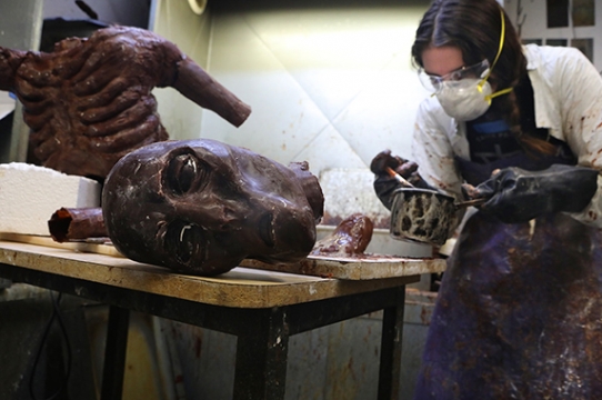 The artist Anastasia Oleson at work on a wax sculpture of a bog creature.