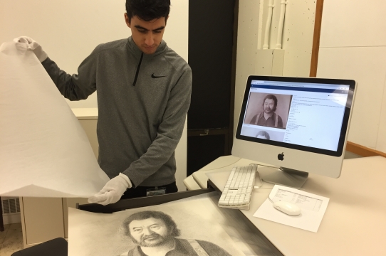Mary Porter Sesnon Art Gallery intern Marco Ahumada works on collections management