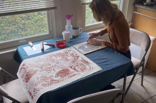 Abby McPhillips working on a relief print